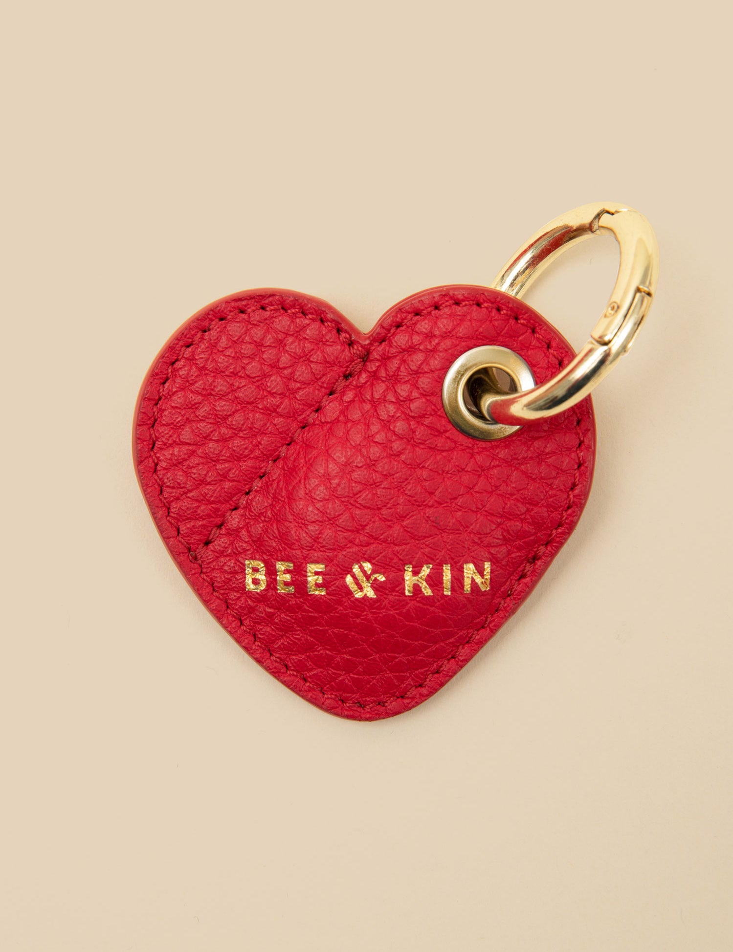 bee-kin-Heart-AirTag-Holder-red-front.jpg